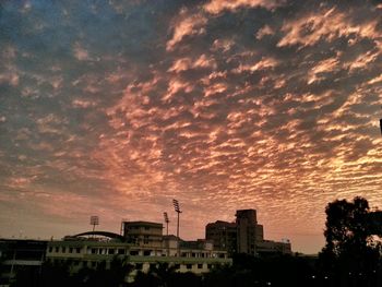 Low angle view of building against cloudy sky