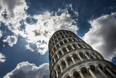 Low angle view of tower against cloudy sky