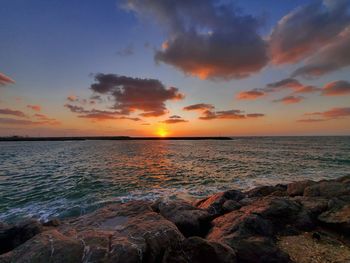 Scenic view of sea against sky during sunset