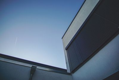 Low angle view of building against clear blue sky