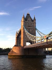 Tower bridge over thames river against sky