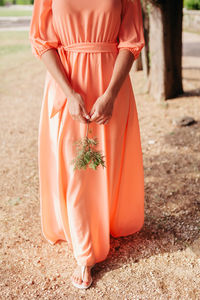 Low section of woman standing outdoors