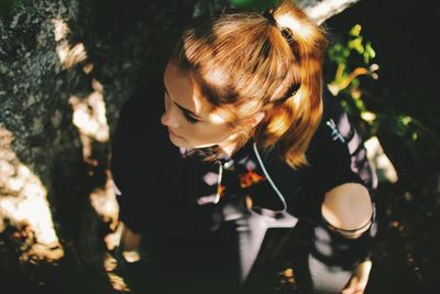 Close-up of young woman looking down