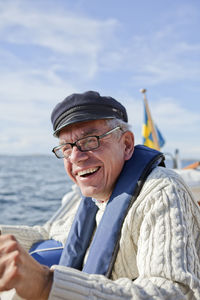 Senior man sailing, grundsund, bohuslan, sweden