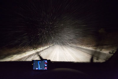 Blurred motion of car against sky at night