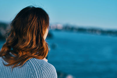 Rear view of woman looking at sea