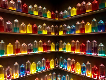 Full frame shot of multi colored bottles on shelf