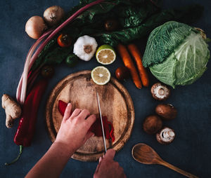 High angle view of man preparing food on table