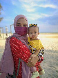 Mother and daughter at beach