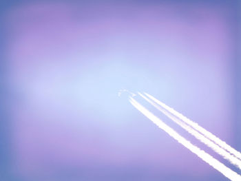 Low angle view of airplane flying against sky