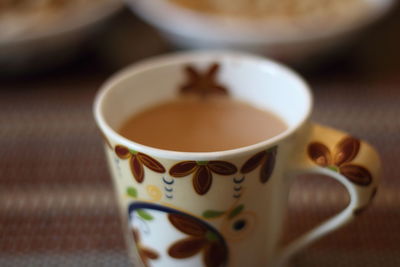 Close-up of coffee cup on table