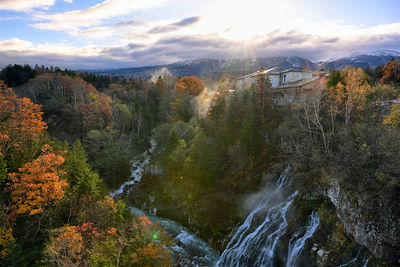 Scenic view of river against sky during autumn