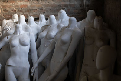 Many display model mannequins in warehouse