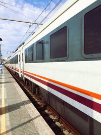 Train at railroad station against sky