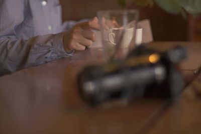 Close-up of hand holding wine at home