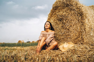 Woman sitting on field