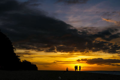 Scenic view of beach against sky during sunset