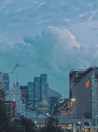 Buildings in city against sky