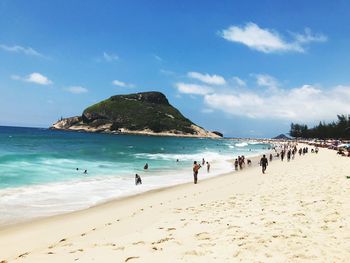 Panoramic view of beach against blue sky