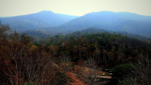 Scenic view of landscape and mountains against sky