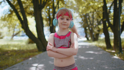 Portrait of young woman standing outdoors