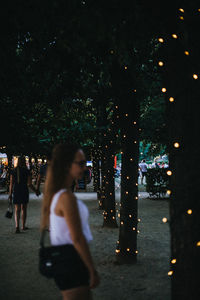 People on street in city at night