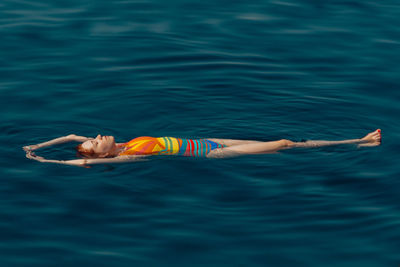 Woman floating in lake