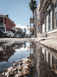 Reflection of buildings in puddle