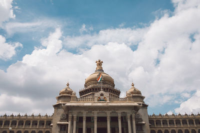 Low angle view of historical building against cloudy sky