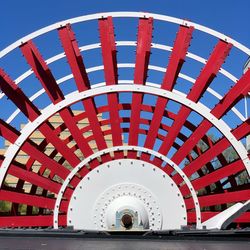 Low angle view of red tower against clear sky