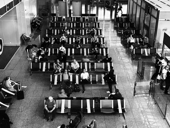 High angle view of people sitting on table