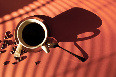 High angle view of coffee cup on table