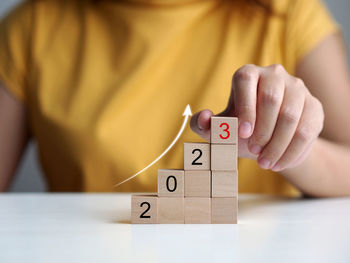 Midsection of woman holding toy blocks