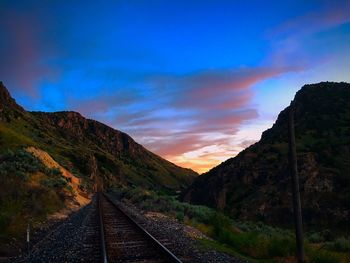 Scenic view of mountains against sky at night