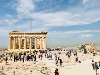 Tourist at historical building against sky