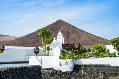 Built structure against mountain range