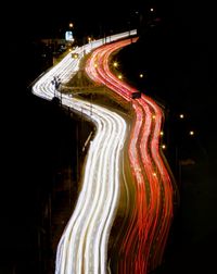 Light trails on road against sky at night in lima