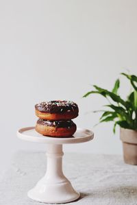 Donuts in cakestand on table