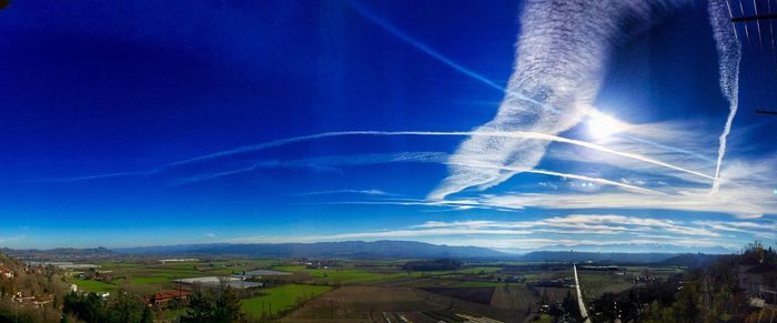 Scenic view of landscape against blue sky