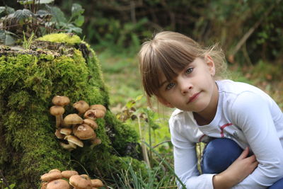 Portrait of girl by mushrooms