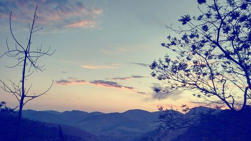 Scenic view of mountains against cloudy sky