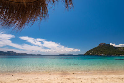 Scenic view of sea against blue sky