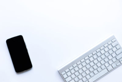 Close-up of computer keyboard against white background