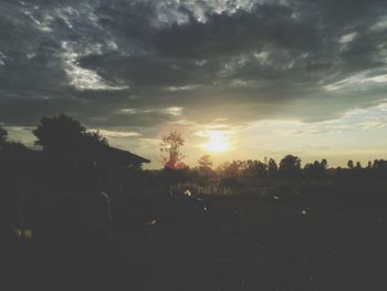 Scenic view of landscape against sky at sunset