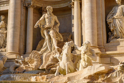 Statue in front of historical building