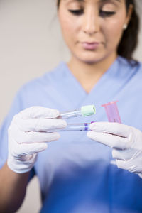 Nurse holding test tubes