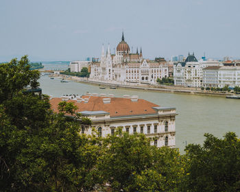 View of buildings and trees in city