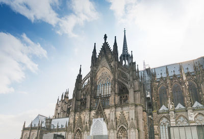 Low angle view of cologne cathedral against sky in city