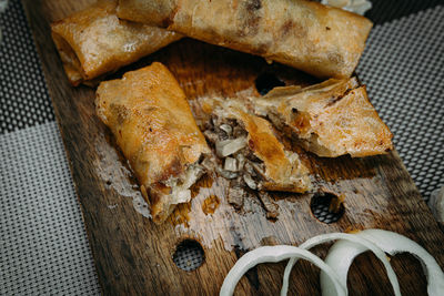 High angle view of bread on cutting board