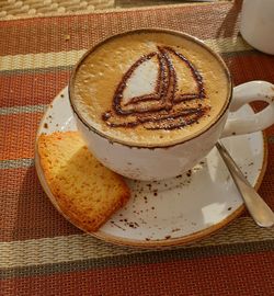 High angle view of coffee cup on table